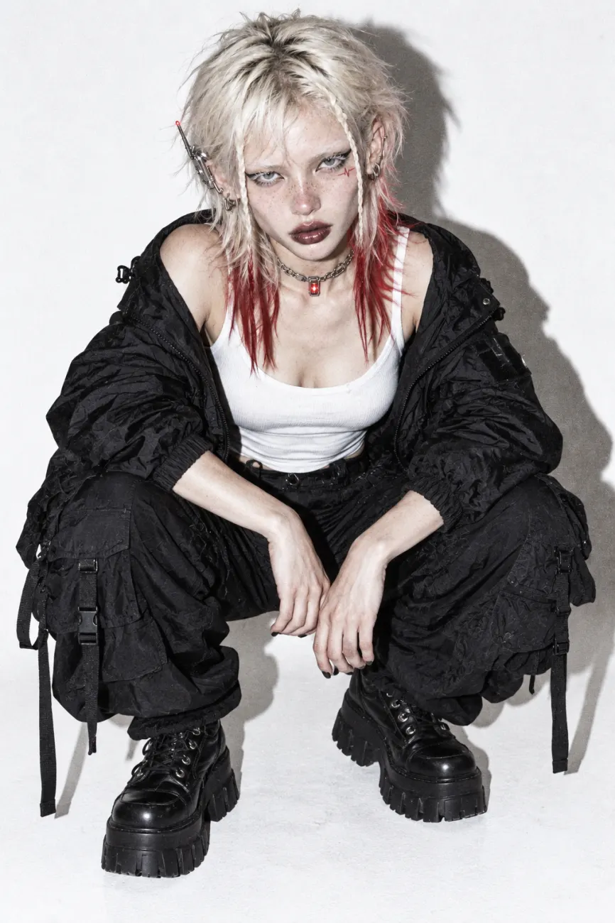 Crouching in a white studio